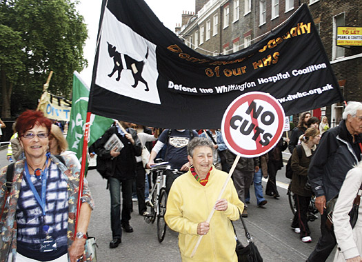 Thousands of marchers, including health workers, take to streets to fight reforms to NHS inews052011_04