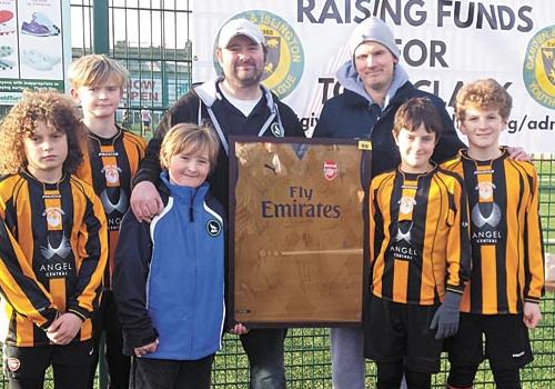 Team effort for Tony: Young players raise funds for boy with rare leukaemia Dave Scrafton, manager of Highbury Wolves, with Tony’s father Anthony Clark and players from Isledon Wolves U-11s