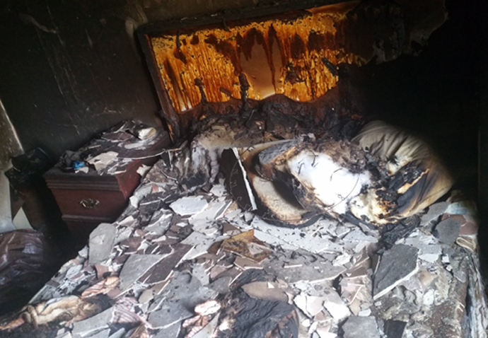 Arrest after neighbours flee 1am flat blaze Spa Green fire
