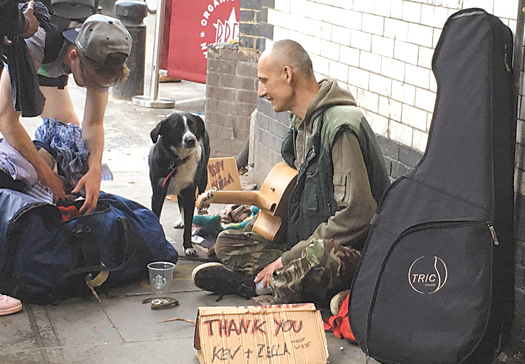 Day in the life of student George and homeless busker Kevin Busker Kevin