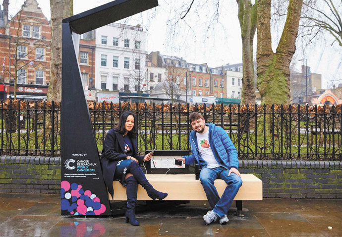 Cllr Claudia Webbe on Smart bench - CREDIT CANCER RESEARCH