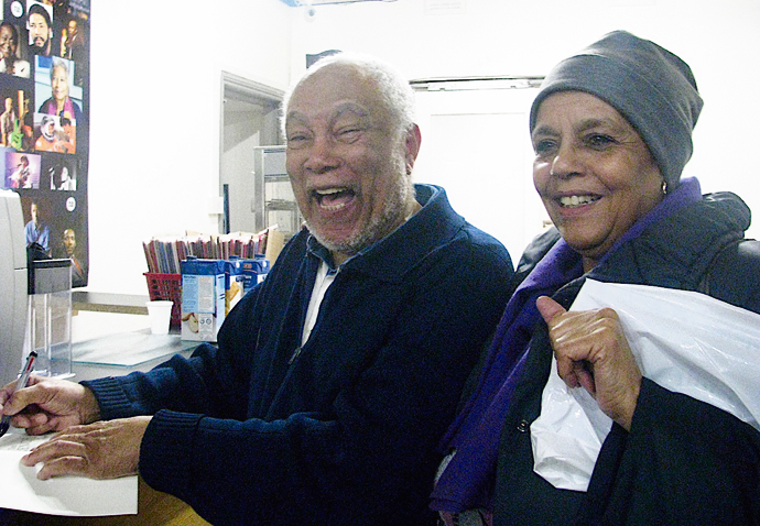 Allister Bain signing a copy of his book for Janette Brewster