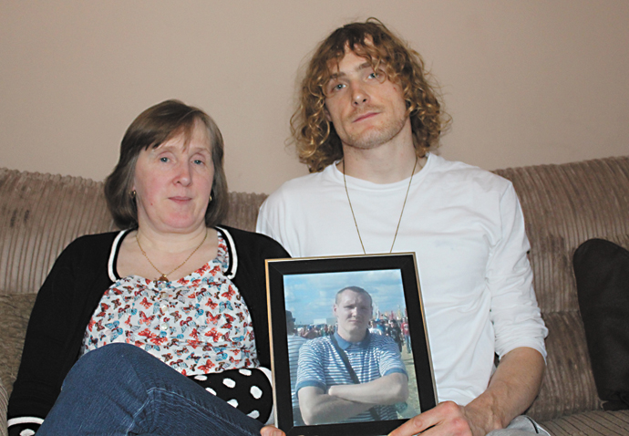 Darren death: ‘Officers escalated the situation’ Carol Neville with photo of Darren Neville and brother Louis