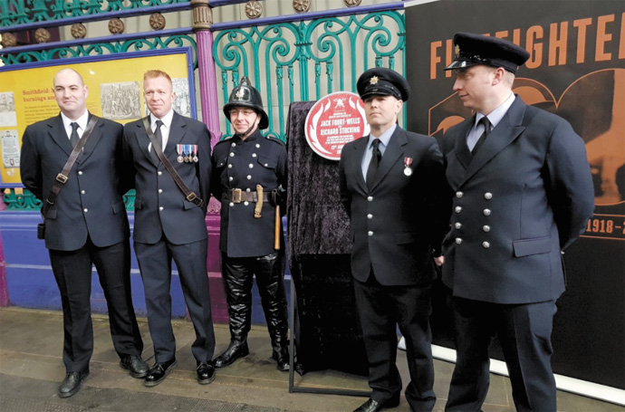 Firefighters remember the men who lost their lives in ‘hugely scary’ blaze Firefighters at Smithfield Market plaque unveiling_Credit London Fire Brigade