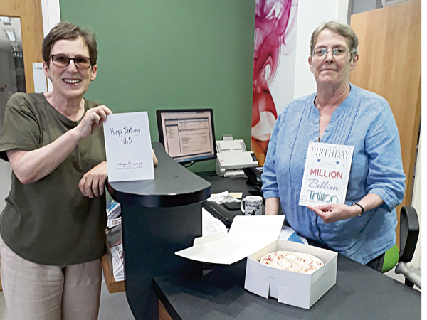 Councillor Vivien Cutler delivering an NHS cake