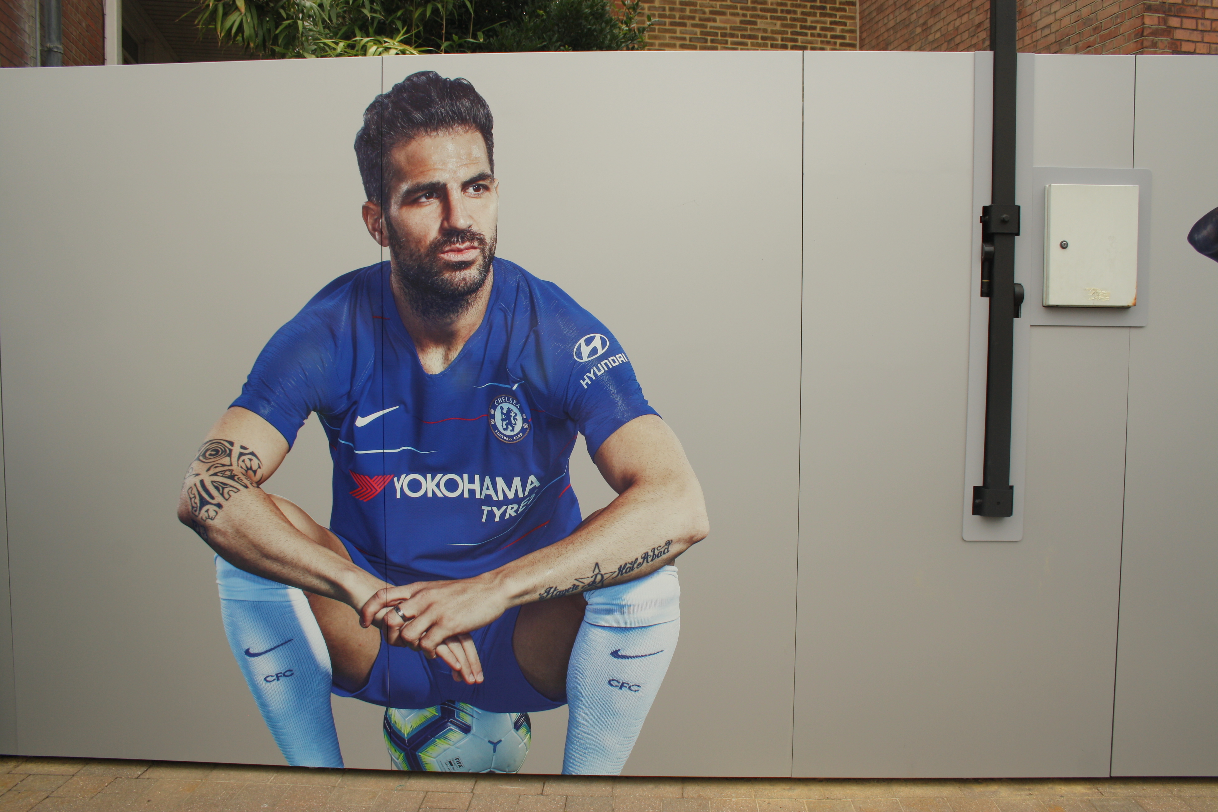 Chelsea 3 Arsenal 2: Matchday player ratings Cesc Fabregas poster outside Stamford Bridge Chelsea kit