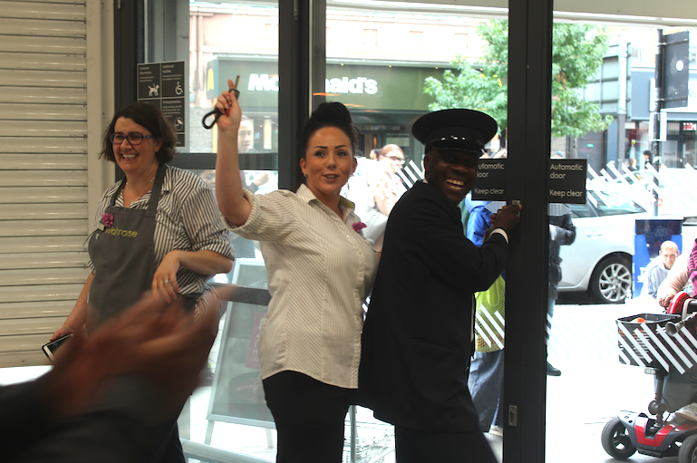 Customers hand staff flowers as Waitrose closes down in Camden High Street cnjphotos 2018-09-13 at 13.27.04