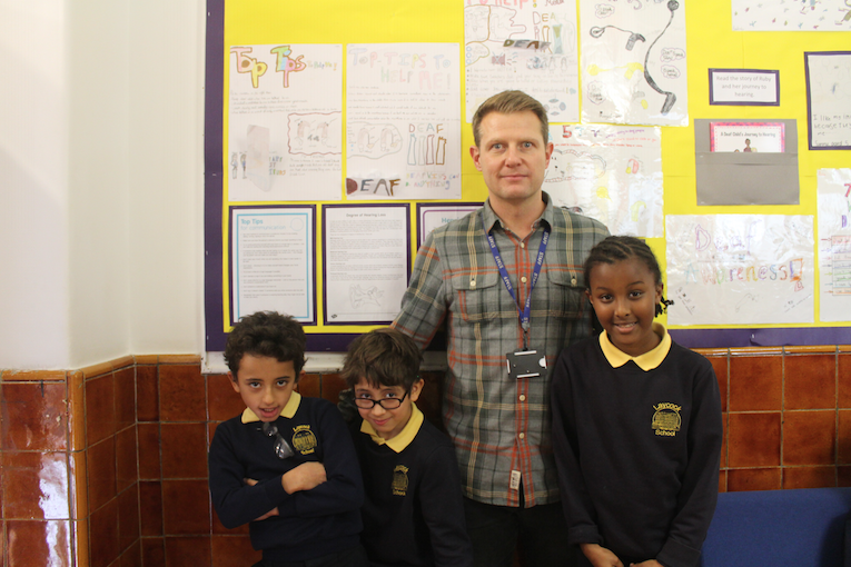 Top-five results for primary school where pupils shine Teacher Dan Frost with Hamdan, Apollo and Kamilah laycock school