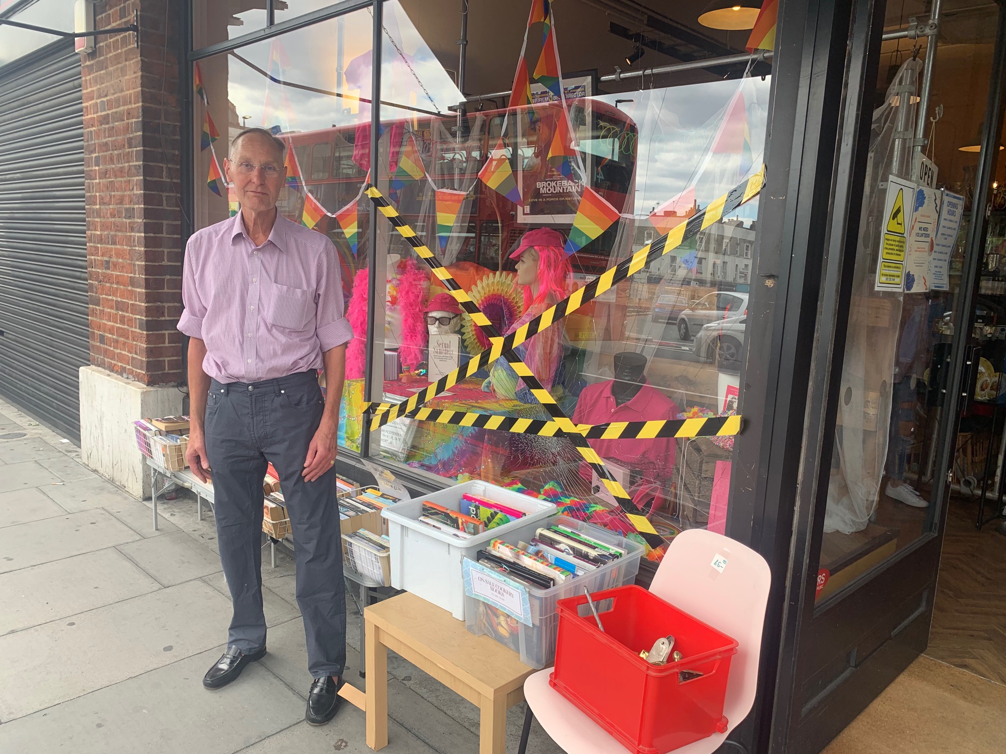 Archway charity shop window with Pride display smashed IMG_1989