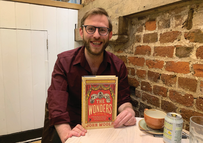 Dr John Woolf with book