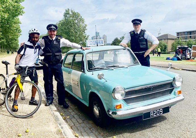 Police with retro 70s car at the festival