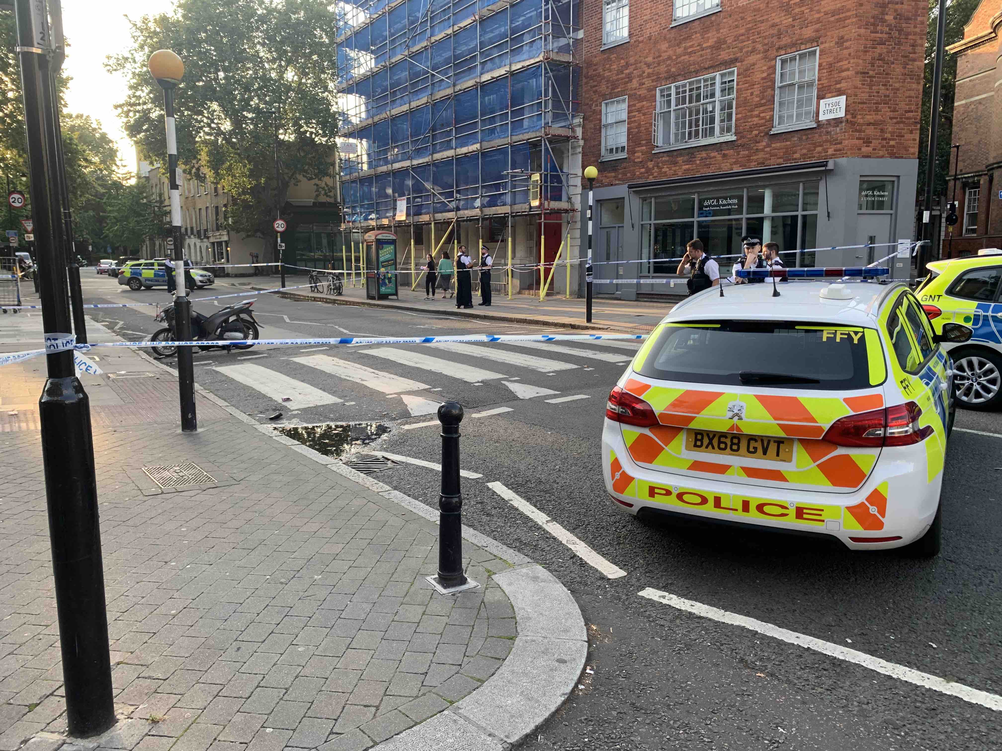 Cafe workers help man stuck under moped after hit-and-run in Clerkenwell tysoe street