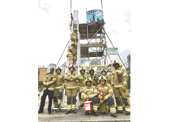 The dozen firefighters outside the Business Design Centre
