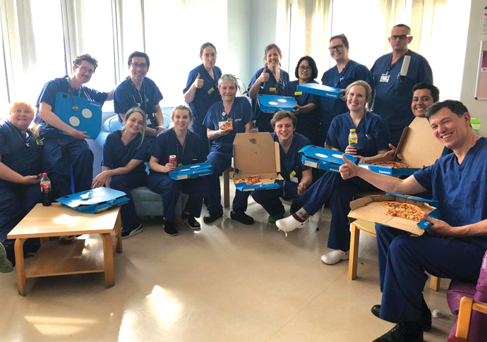 Nurses with pizzas