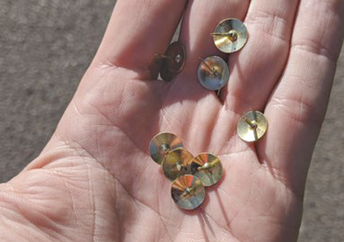 Cyclists ‘targeted with pins and nails’ during lockdown rides Cyclist drawing pins handful of tacks