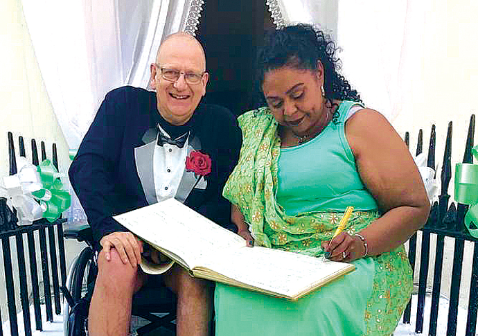 Carer is wed on his doorstep in final days Steve Reading and Carol signing the marriage certificate