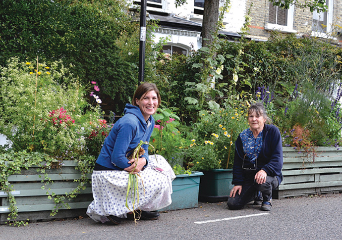 Street planters question cost of cutting Town Hall red tape Lynne Friedli and Helena Farstad in Mayton Street