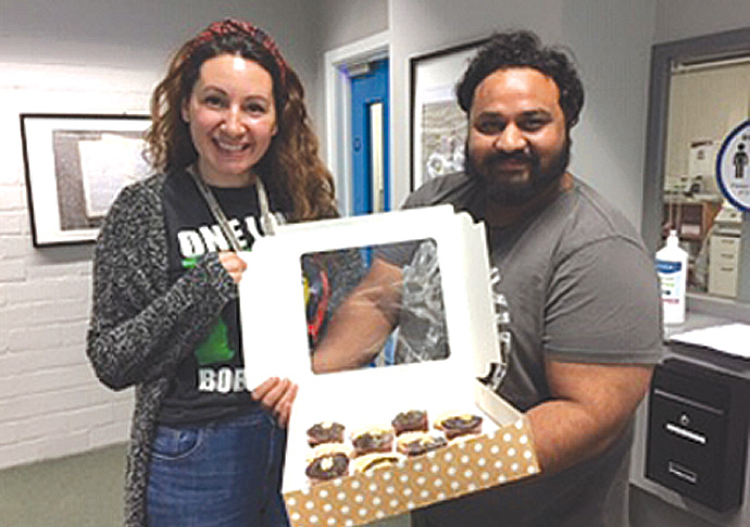 School’s end of term cake-off acland ABS staff Charli Faux and Akbar Quayeem