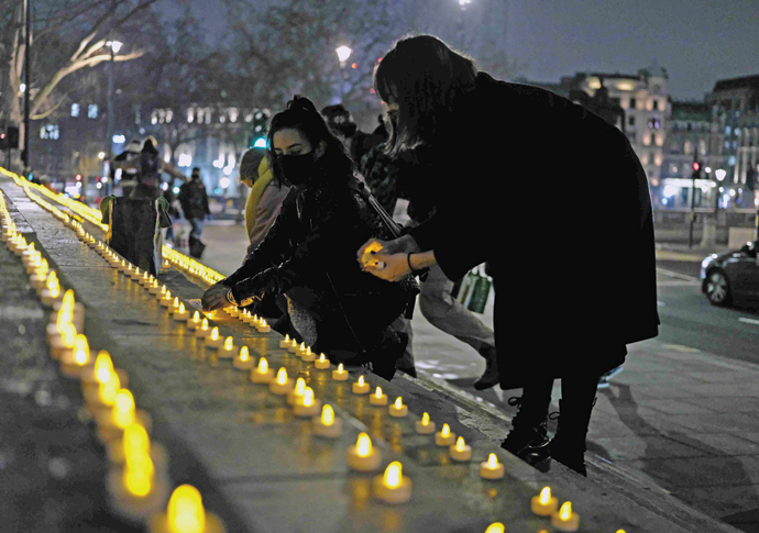 Candles are lit for those who died without a home Candles for homeless who have died