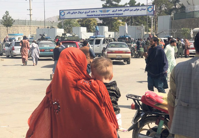 Don’t scapegoat Afghans Crowds at Kabul International Airport_photo voa wikimedia commons