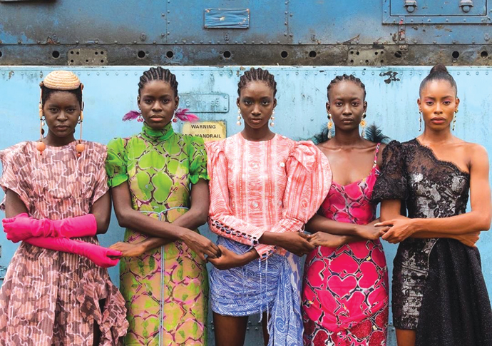 African prints Models holding hands Lagos Nigeria 2019. By Stephen Tayo Courtesy Lagos Fashion Week