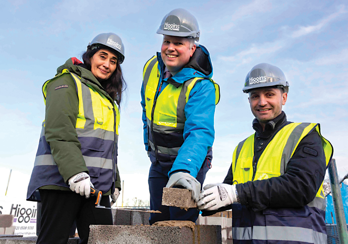 Builders reach the top floor of homes block Cllr Cinko-Oner Cllr Ward and Cllr Turan at the Dixon Clark Court topping out ceremony.