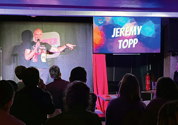 Hear the one about the pioneering LGBTQ+ comedy club? Jerermy Topp performing at one of the queer comedy nights set up by the group