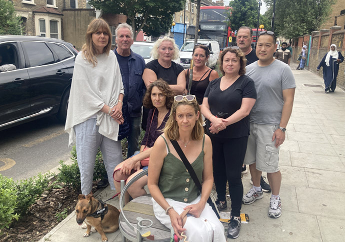 Fresh calls to put the brakes on LTNs LTN campaigners with traffic backed up behind them in Blackstock Road