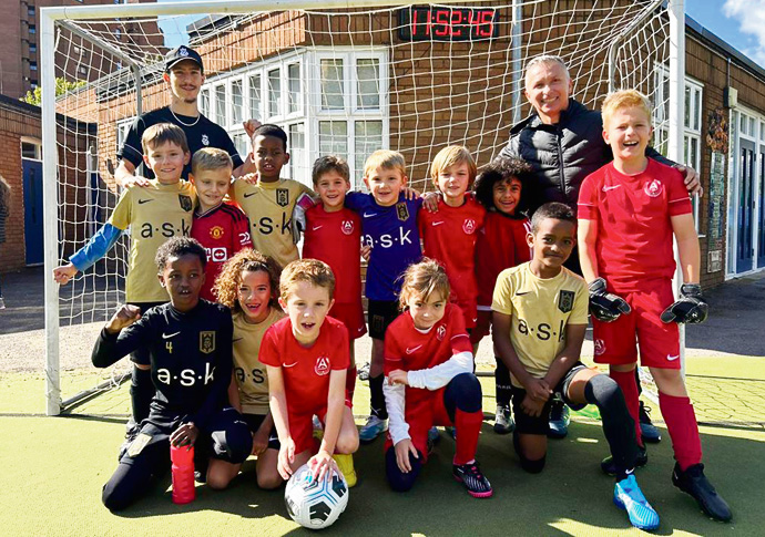 Going extra miles for top competition Bloomsbury Football Academy in black and gold and in red AA Academy U8s