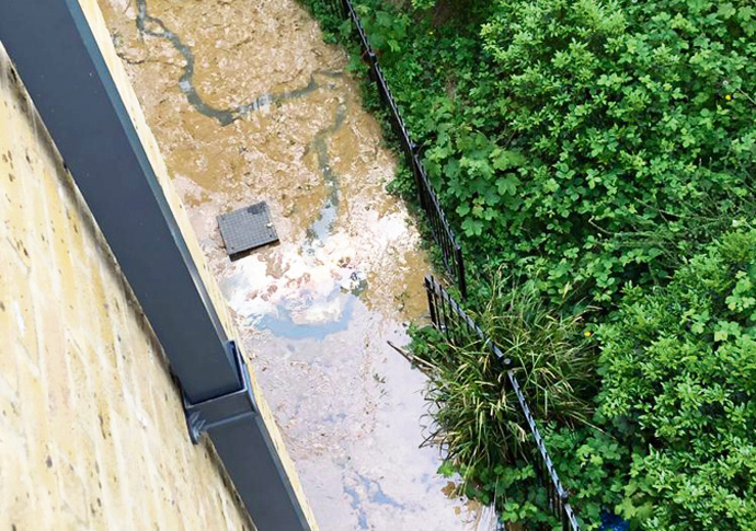 River of raw sewage runs next to homes raw sewage in the estate new