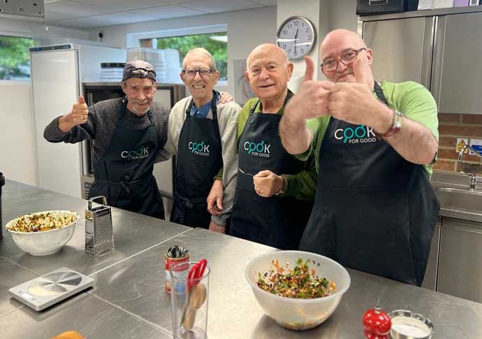 Alec and others in cooking class