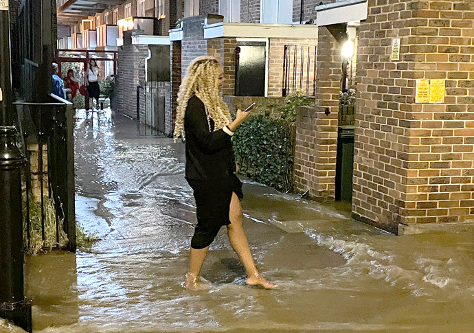 Flood woman walks home from night out-1