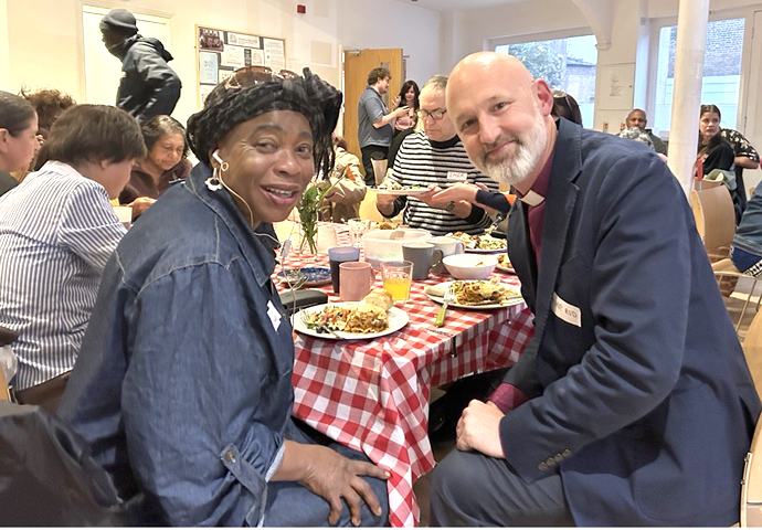 Supper club_Bishop Rod sharing in a meal with guests at the Haven Supper Club - cred Diocese of London